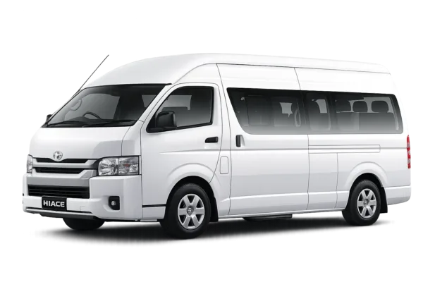 Toyota Hiace Commuter putih tampak serong depan dan samping untuk layanan sewa Hiace Bandung dengan driver profesional
